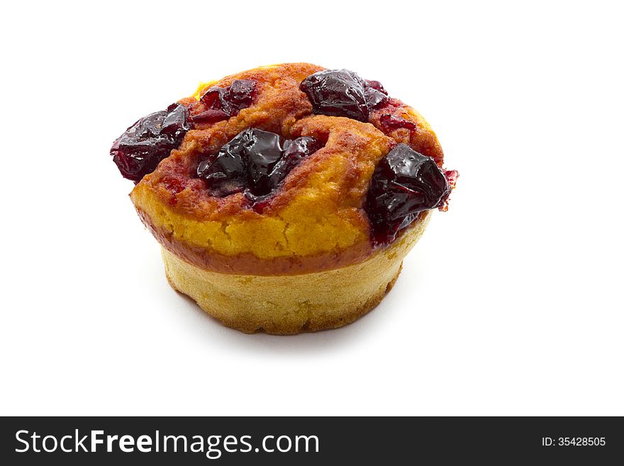 Homemade muffin with cherry isolated on white background
