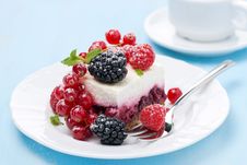 Dessert - A Piece Of Cake With Fresh Berries On Blue Background Stock Photos