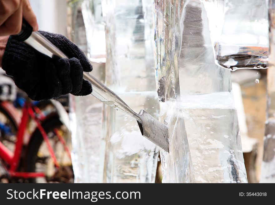 Ice Carver Using Chisel to Carve. Ice Carver Using Chisel to Carve