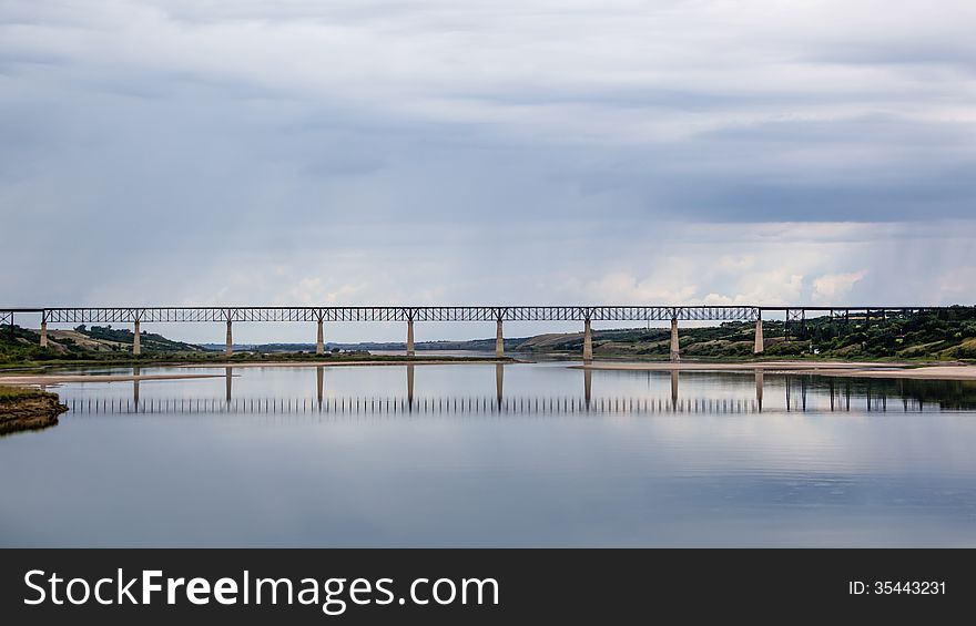 Long steel bridge across the lake
