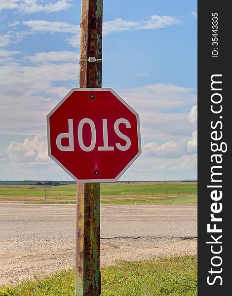 Upside down stop sign at an intersection. Upside down stop sign at an intersection