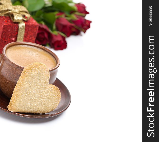 Coffee, cookie in the shape of heart, gift and roses
