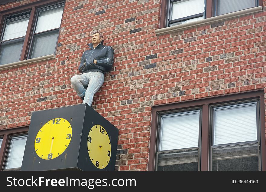 Mannequin on the wall clock as symbol of date ,but for him this date is perpetual. Mannequin on the wall clock as symbol of date ,but for him this date is perpetual