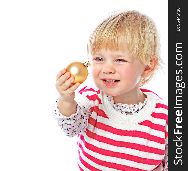 Portrait of a little girl holding a Christmas ball, celebration