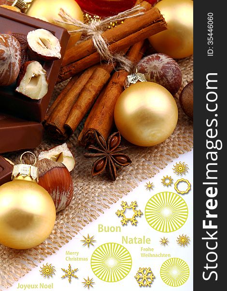 Christmas balls with chocolate, hazelnuts and cinnamon on jute cloth and white background. Christmas balls with chocolate, hazelnuts and cinnamon on jute cloth and white background