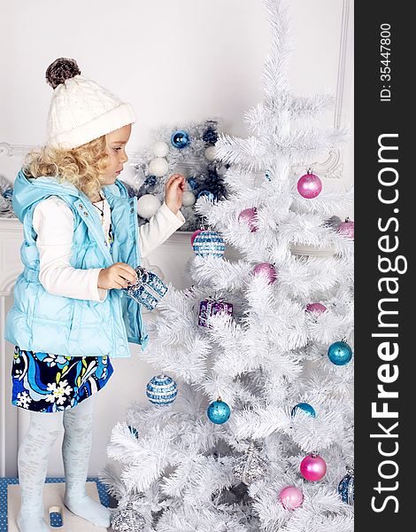 Little cute girl decorate Christmas tree. Little cute girl decorate Christmas tree