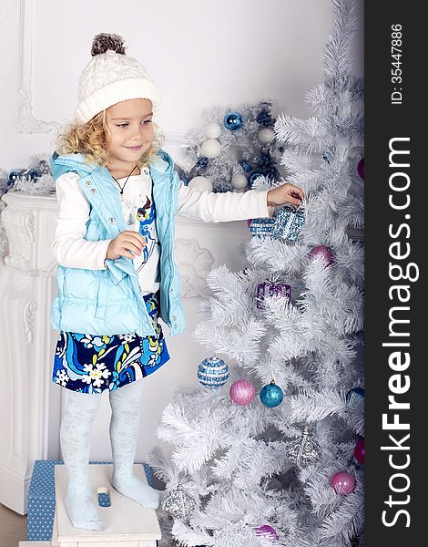 Little cute girl decorate Christmas tree. Little cute girl decorate Christmas tree