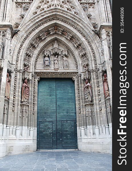 Old big metal door. Seville Cathedral, Spain, Europe. Old big metal door. Seville Cathedral, Spain, Europe