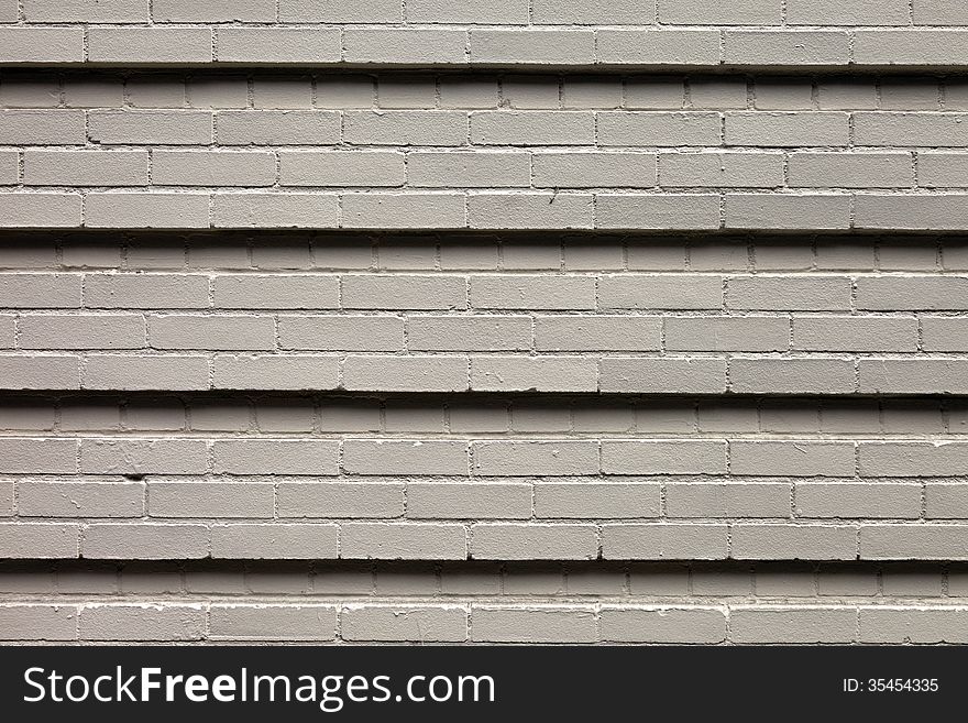 A flat wall with lots of detail and texture made of bricks for background. High Resolution. A flat wall with lots of detail and texture made of bricks for background. High Resolution.