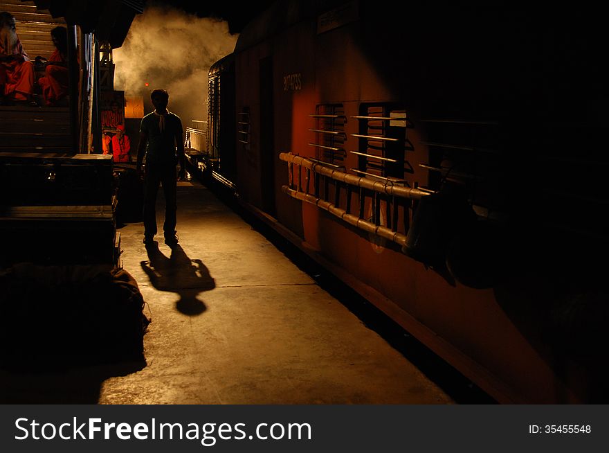 Man silhouette at station night