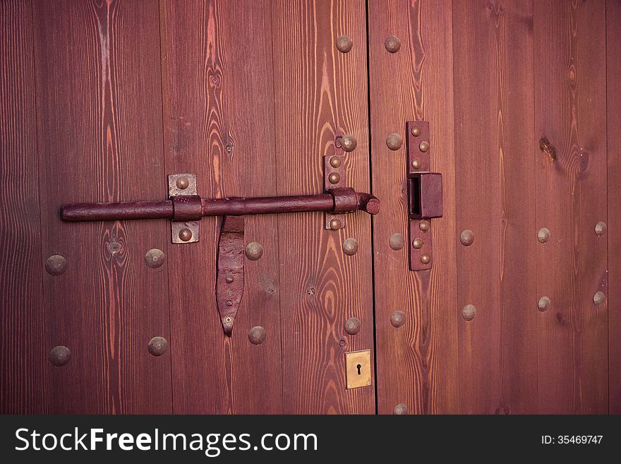 Lock on old wooden door. Vintage retro style