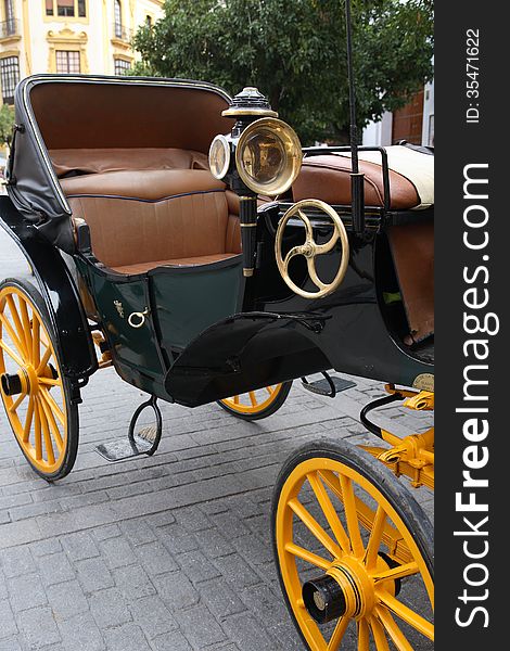 Closeup of nice vintage coach with big yellow wheels