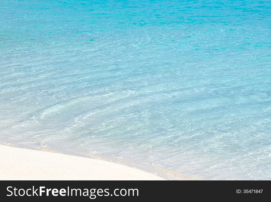 Turquoise water and white sand Nude Island, in Aitutaki Lagoon Cook Islands.