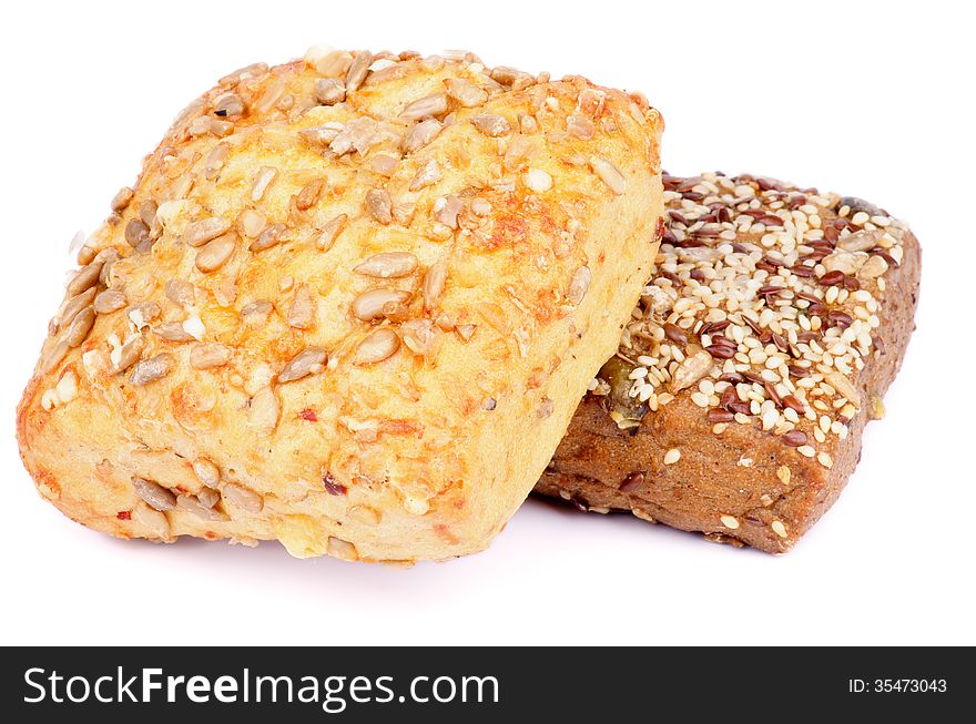 Heap of Sunflower Seeds and Sesame Seeds Buns isolated on white background. Heap of Sunflower Seeds and Sesame Seeds Buns isolated on white background