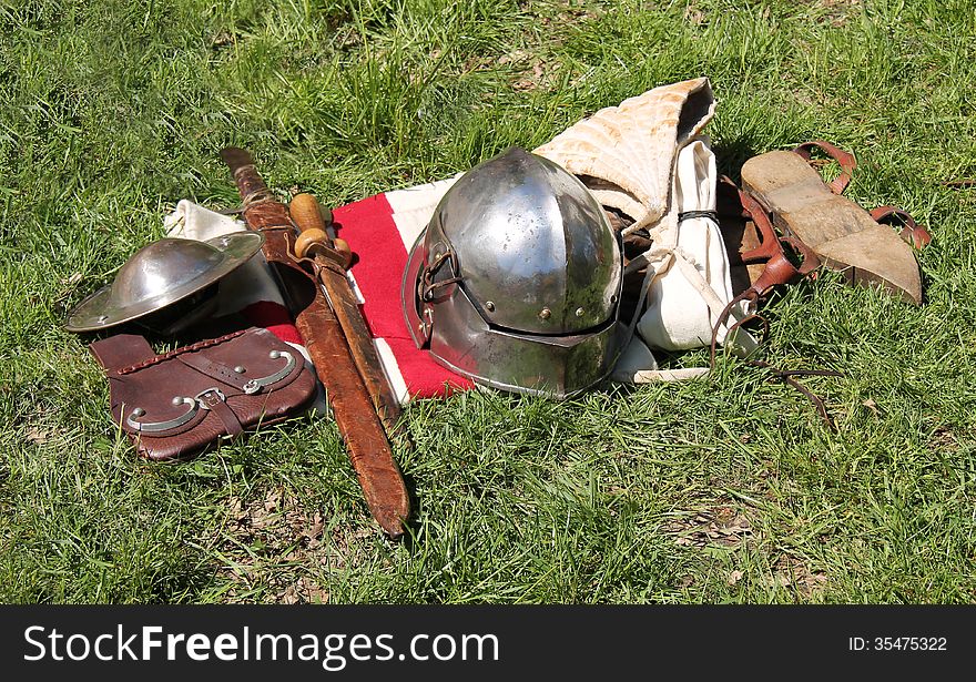 A Medieval Outfit of Armour Clothes and Weapons.