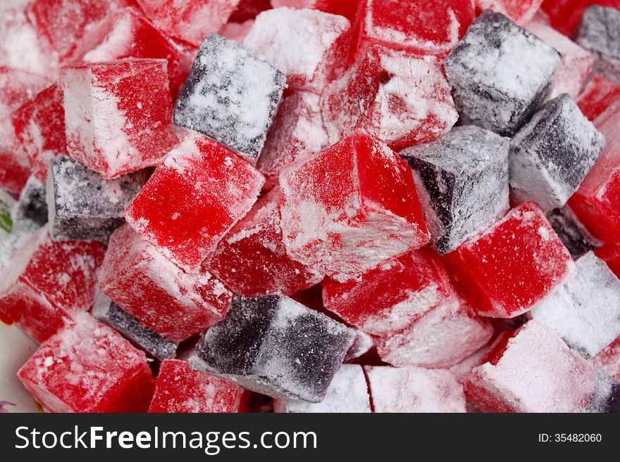 Turkish delight pieces with powdered sugar.