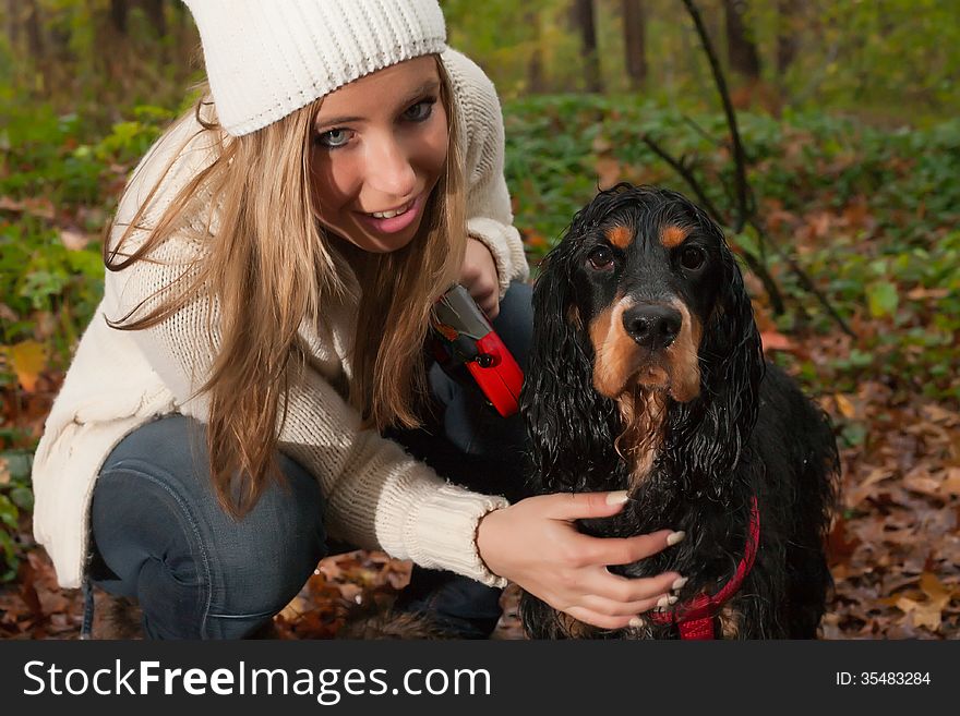 Girl and her dog are having a wet time in the rain. Girl and her dog are having a wet time in the rain