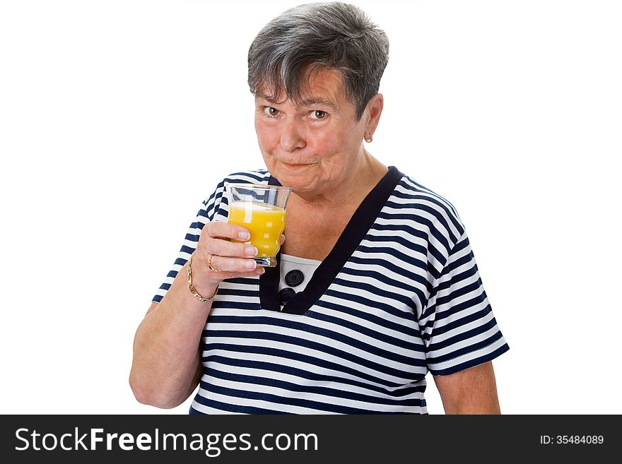 Senior woman drinking orange juice - isolated. Senior woman drinking orange juice - isolated