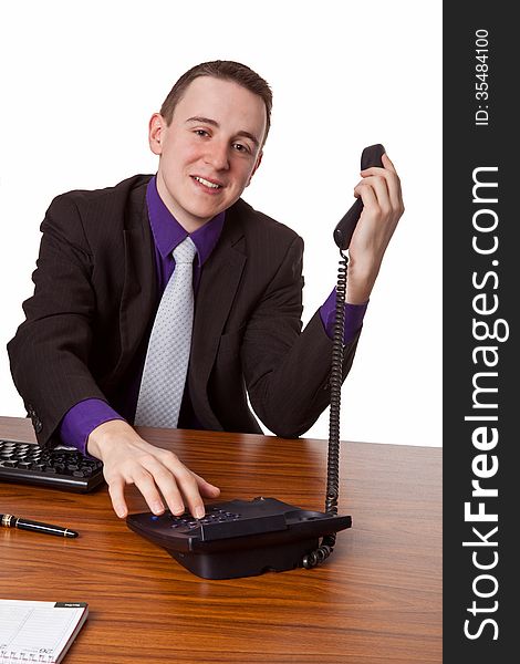 Businessman at his desk is calling up - isolated. Businessman at his desk is calling up - isolated