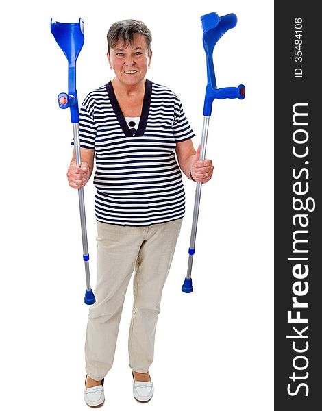 Senior woman with crutches - isolated on white. Senior woman with crutches - isolated on white
