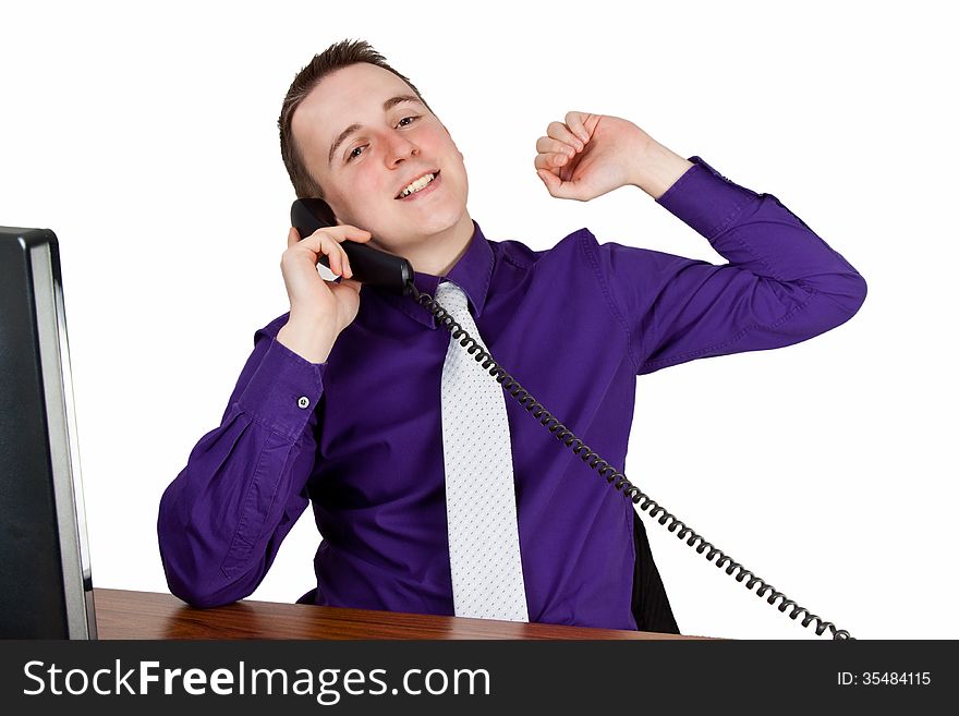 Young businessman calling at his desk - isolated