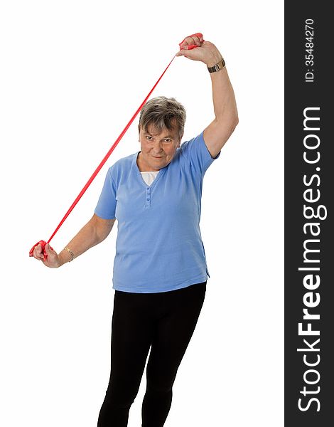 Senior woman exercising with rubber band - isolated. Senior woman exercising with rubber band - isolated