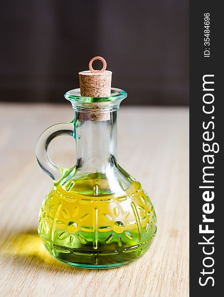 Small bottle of olive oil with cork stopper