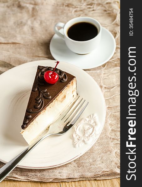 Chocolate cake with cherry and coffee