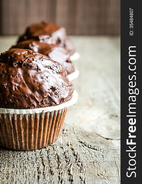 Row of three chocolate muffins