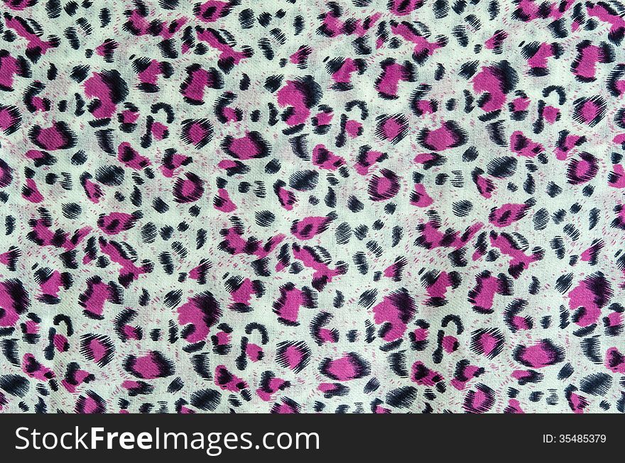 The fabric of motifs leopard on background