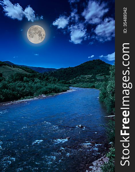 Wild mountain river in mountains on a clear summer night. Wild mountain river in mountains on a clear summer night