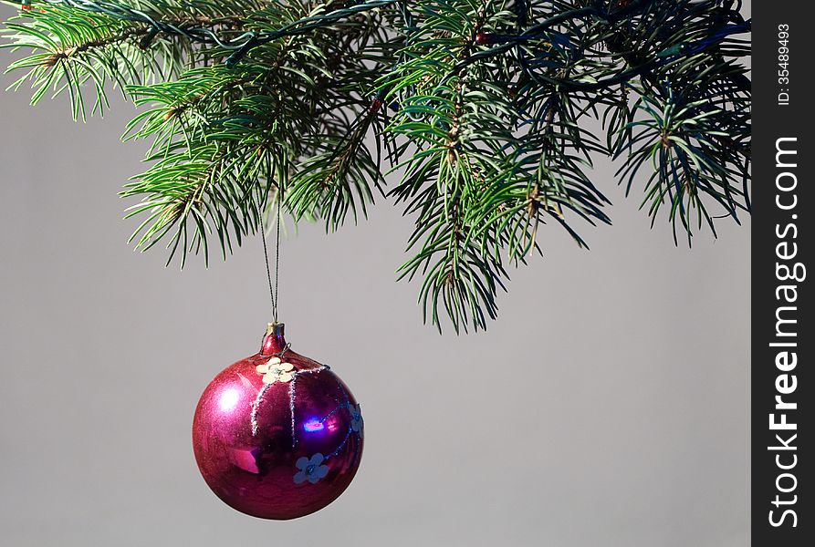 The decoration of Christmas trees. On Christmas eve, on the branches of a spruce hung toys and garlands.