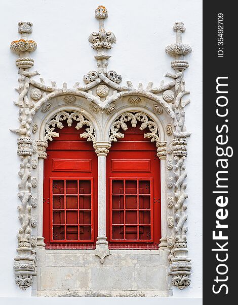 Red Windows With Ornamental Stonework