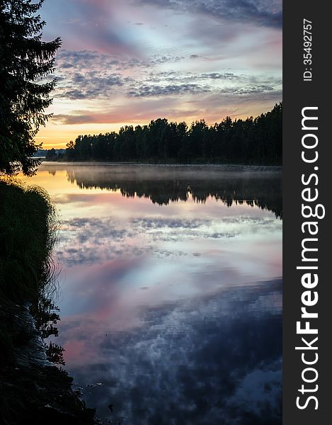 Dramatic sunset over the river in Karelia, the north of Russia. Dramatic sunset over the river in Karelia, the north of Russia