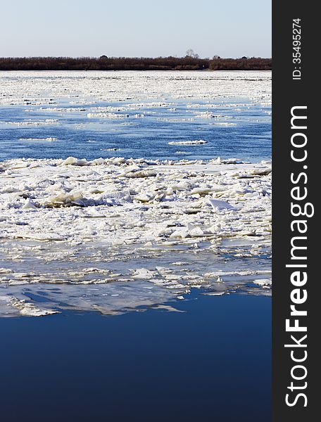 Ice drift on the river the late fall in the bright sunny day