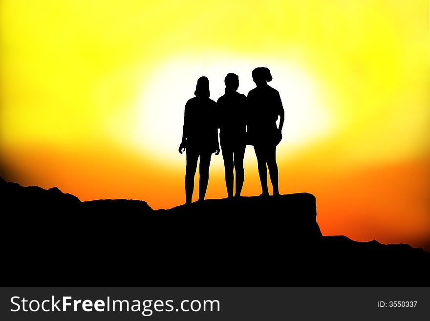 Silhouette of three females in sunset. Silhouette of three females in sunset