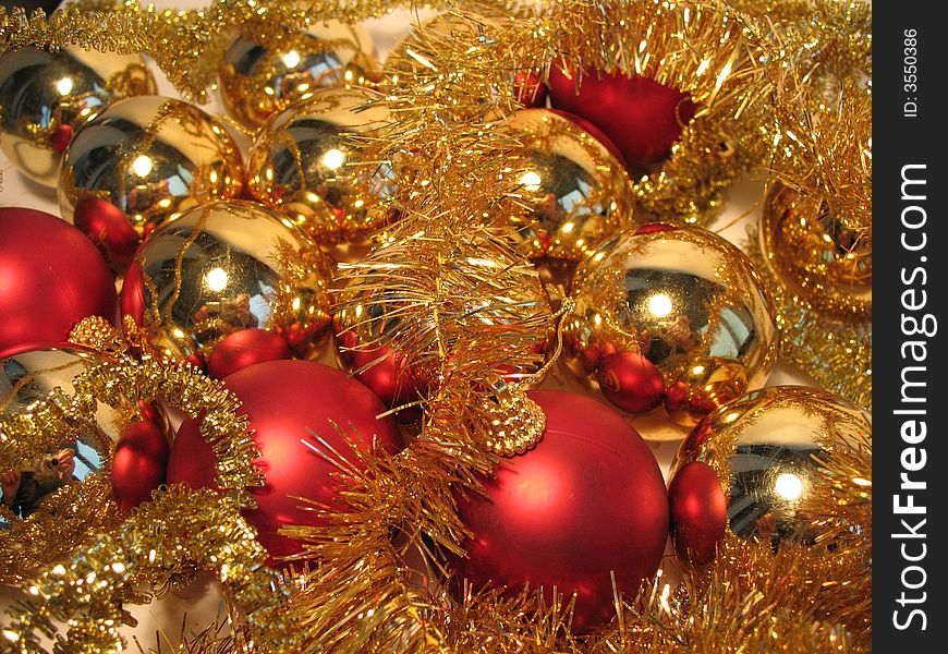 Christmas decoration with red and  golden balls and glare. Christmas decoration with red and  golden balls and glare