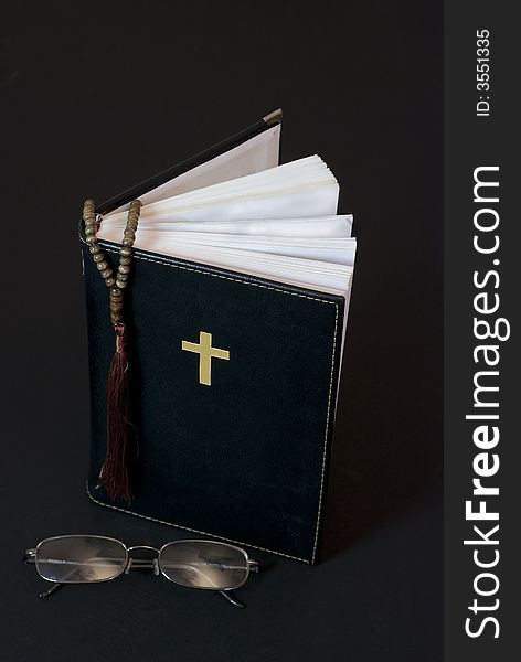 Holy bible with glasses and dark background. Holy bible with glasses and dark background