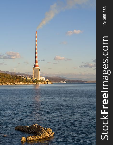 Hydroelectric plant with sky and clouds in the background. Hydroelectric plant with sky and clouds in the background