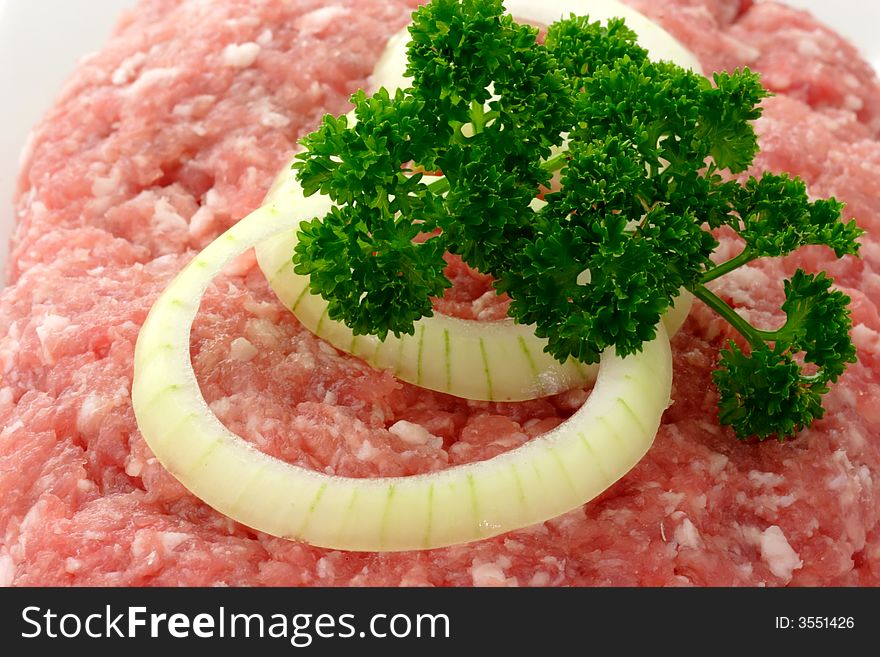 Meatloaf with onion rings and herbs