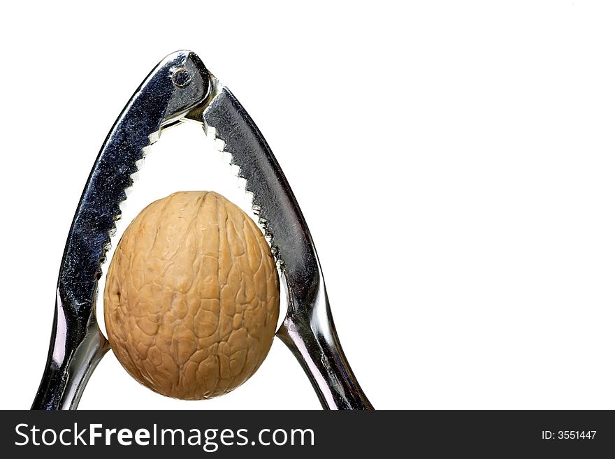 Walnut with nutcracker, isolated on white background