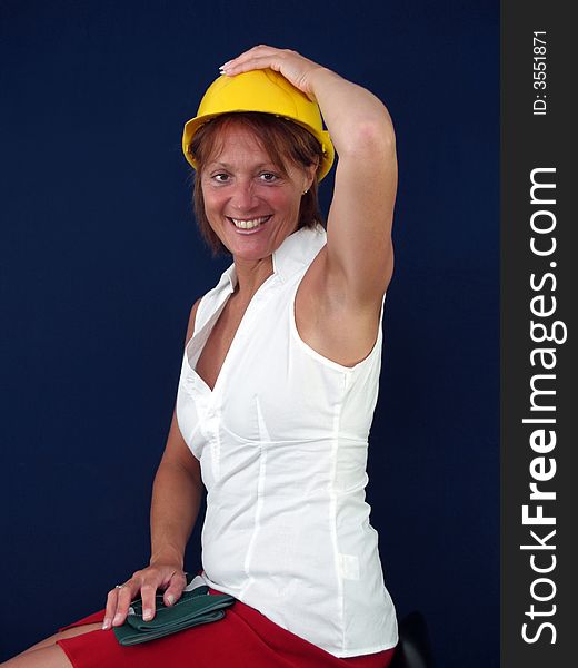 Lady builder trying to keep her hat on