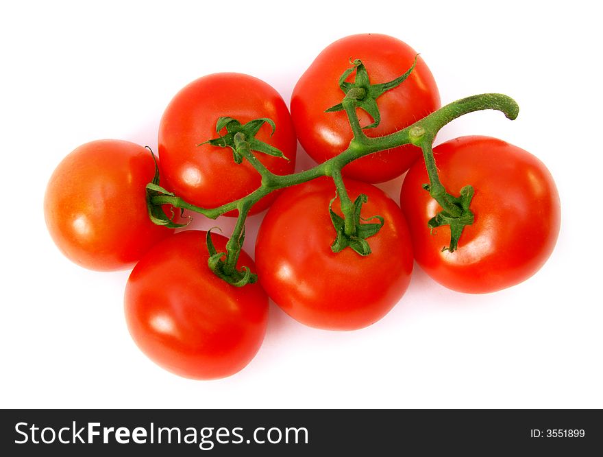 A lot of red tomatoes is on a white background.