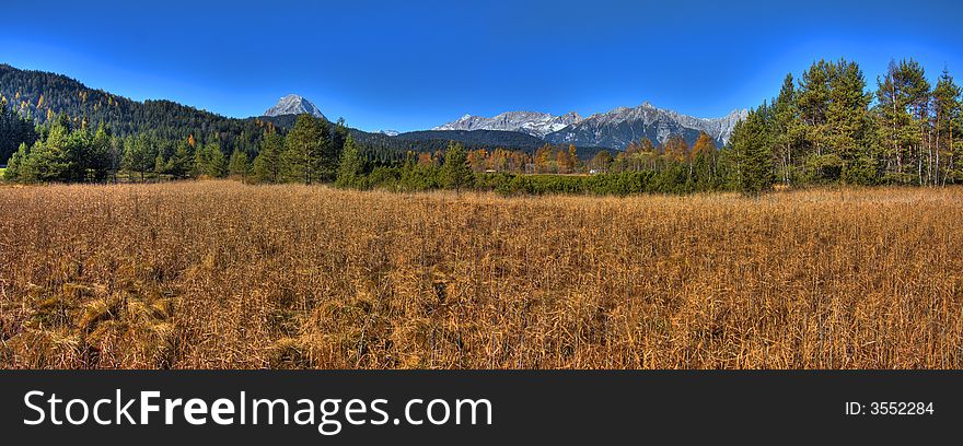 2 shot panorama of a landscape with mountainous background. 2 shot panorama of a landscape with mountainous background