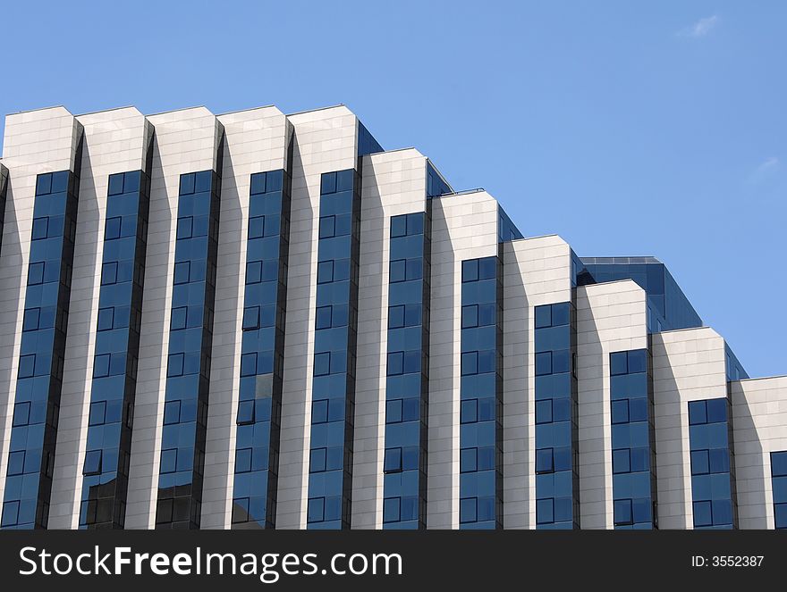 Modern workplace building against blue sky