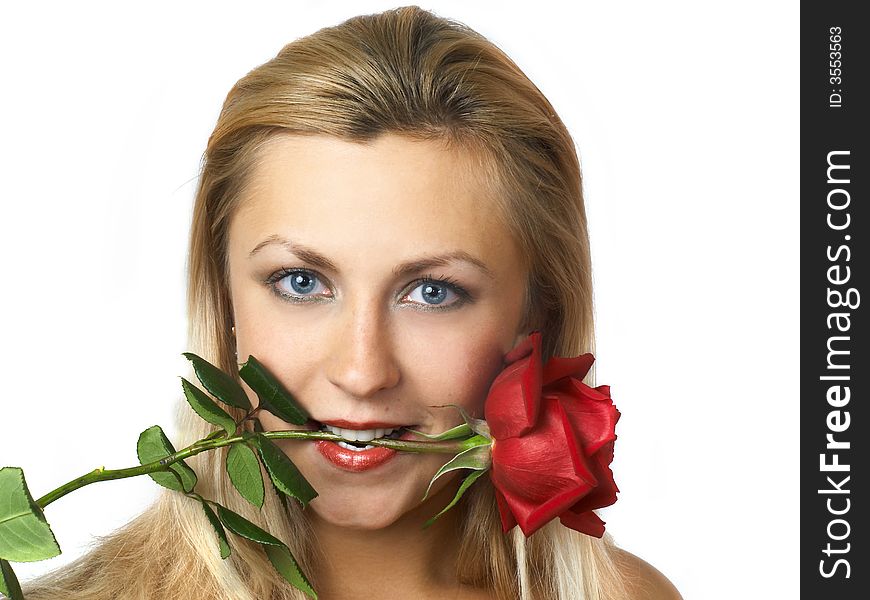 Happy girl holding a rose in her mouth. Happy girl holding a rose in her mouth