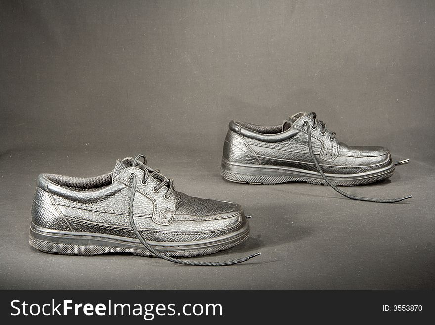 New brown business shoes on gray background. New brown business shoes on gray background