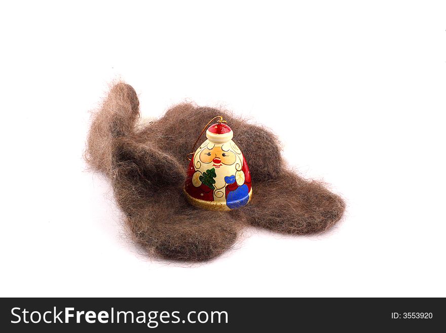 Wooden russian santa claus on the cozy downy knitted mitten. Wooden russian santa claus on the cozy downy knitted mitten