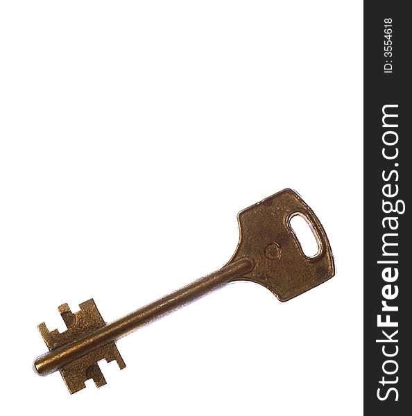 Old brass key isolated on white