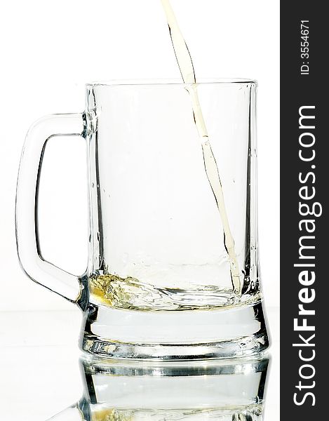 Beer in glass on the white background